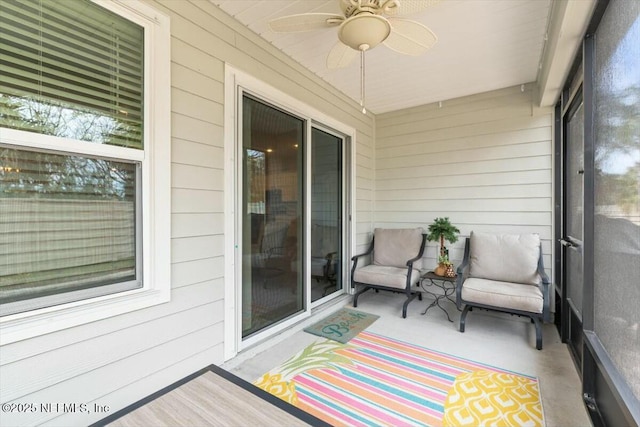 sunroom with a ceiling fan