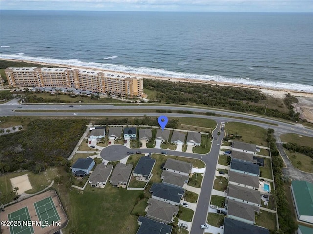 bird's eye view featuring a view of the beach and a water view