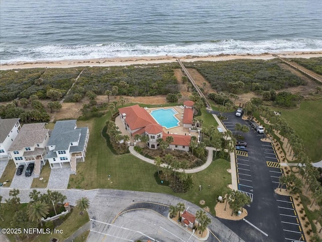 drone / aerial view with a water view and a view of the beach