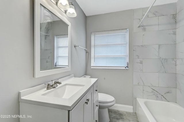 full bathroom featuring tiled shower / bath, vanity, toilet, and tile patterned floors