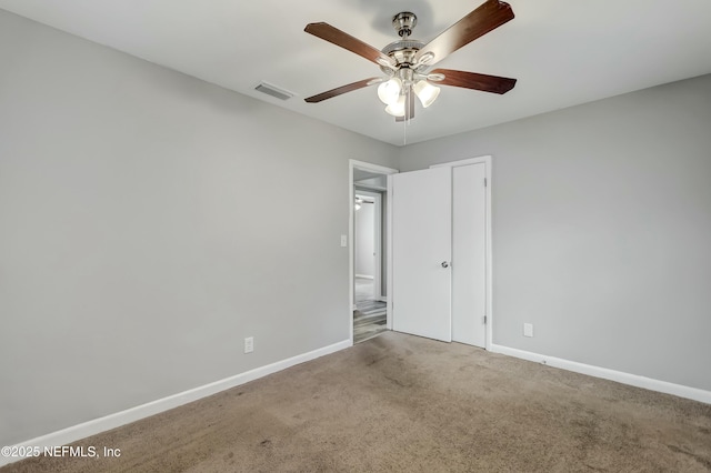 interior space featuring carpet, ceiling fan, and a closet