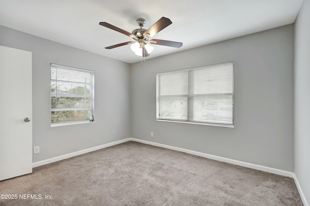 carpeted empty room with ceiling fan