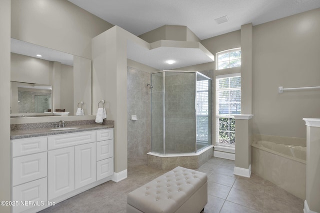 bathroom featuring a garden tub, vanity, visible vents, a tile shower, and tile patterned floors