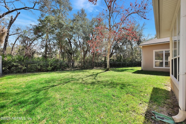 view of yard with fence