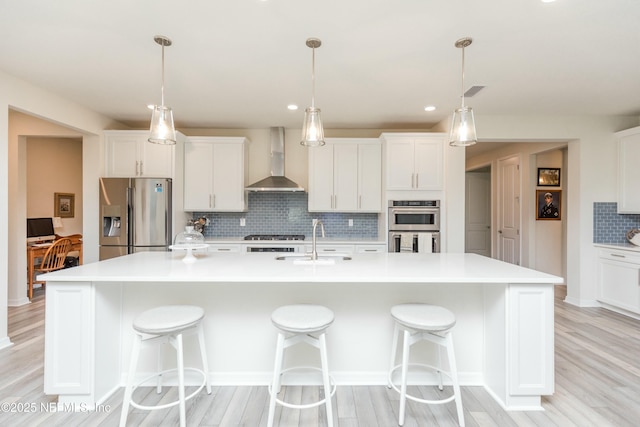 195 Glen Valley Dr, Ponte Vedra, FL 32081 - kitchen featuring wall chimney exhaust hood, stainless steel appliances, a sink, backsplash, and white cabinets