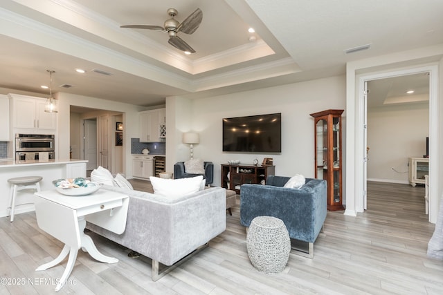 195 Glen Valley Dr, Ponte Vedra, FL 32081 - living room with ceiling fan, a raised ceiling, crown molding, light wood-style flooring, and recessed lighting