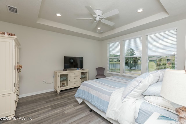 195 Glen Valley Dr, Ponte Vedra, FL 32081 - bedroom with a raised ceiling, wood finished floors, baseboards, ceiling fan, and recessed lighting