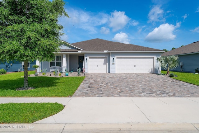 195 Glen Valley Dr, Ponte Vedra, FL 32081 - ranch-style house featuring decorative driveway, a front lawn, a garage, and a porch