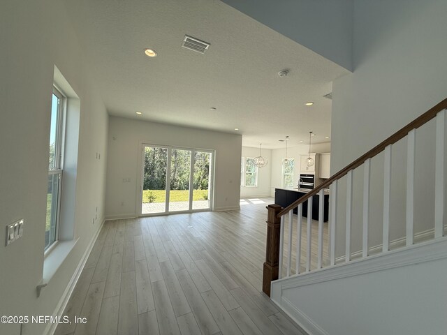 35 Mahogany Way, Palm Coast, FL 32164 - interior space with light hardwood / wood-style flooring and a textured ceiling