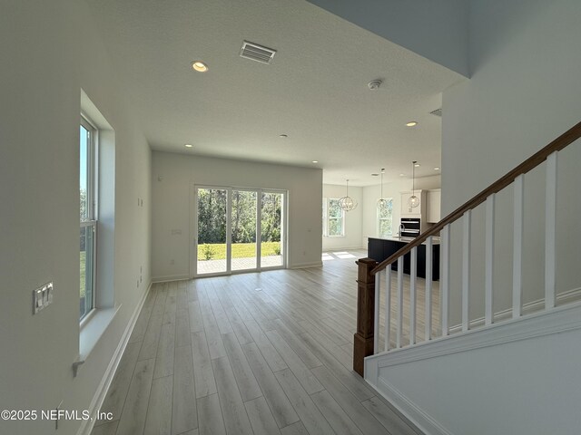 35 Mahogany Way, Palm Coast, FL 32164 - interior space featuring light hardwood / wood-style floors and a textured ceiling