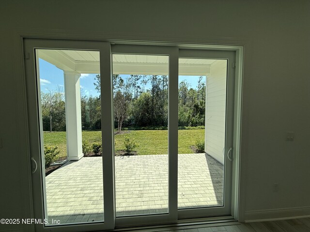 35 Mahogany Way, Palm Coast, FL 32164 - doorway with hardwood / wood-style floors
