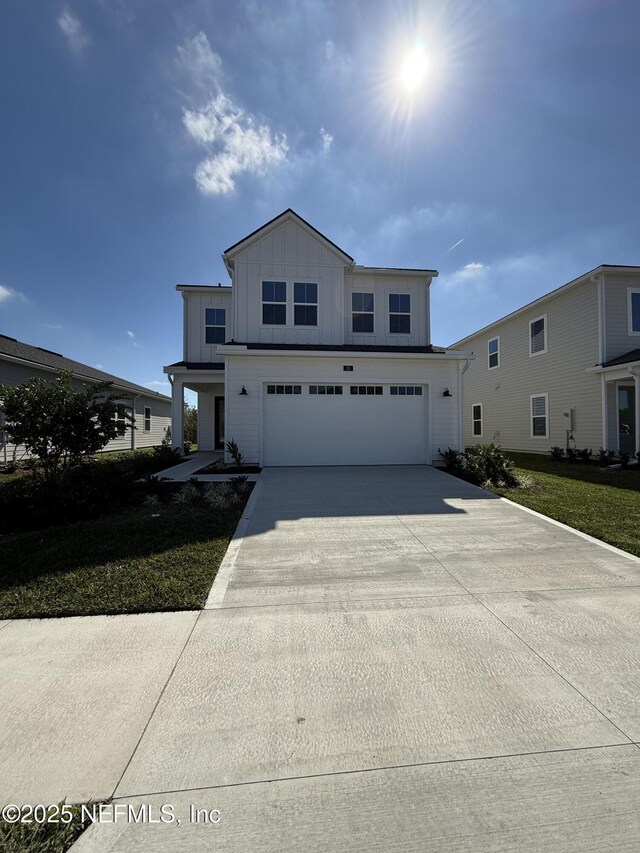 35 Mahogany Way, Palm Coast, FL 32164 - view of property with a garage and a front yard