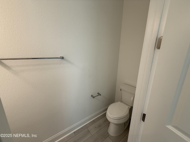 35 Mahogany Way, Palm Coast, FL 32164 - bathroom with hardwood / wood-style flooring and toilet
