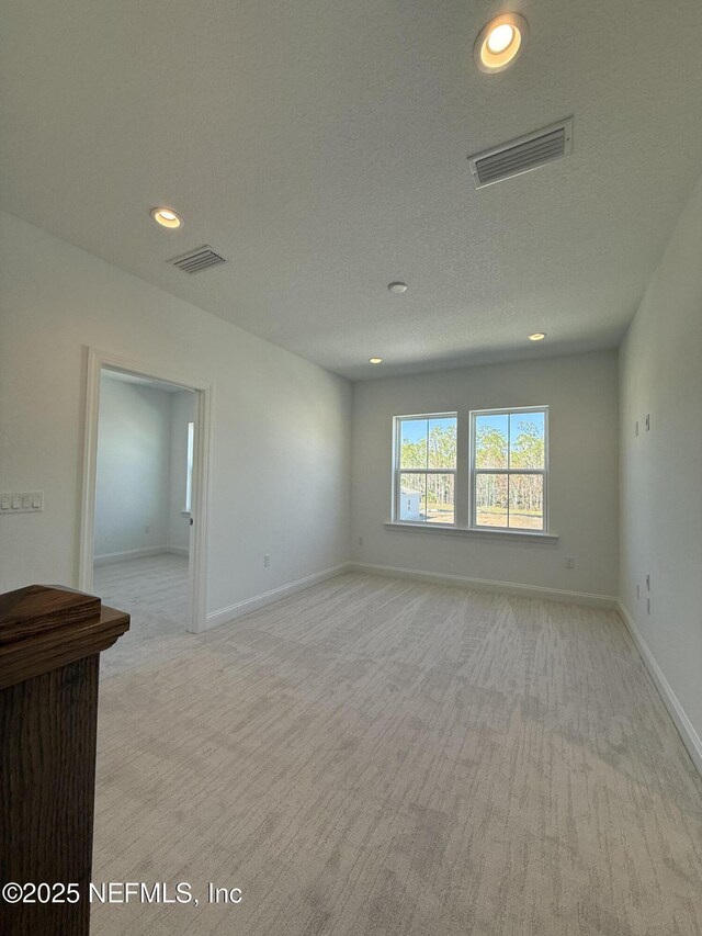 35 Mahogany Way, Palm Coast, FL 32164 - unfurnished room with a textured ceiling