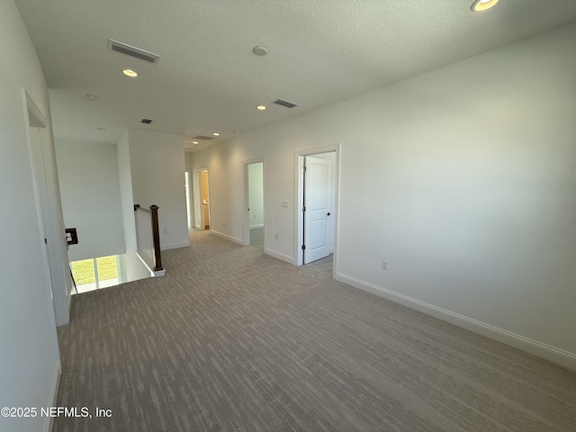 35 Mahogany Way, Palm Coast, FL 32164 - carpeted spare room with a textured ceiling