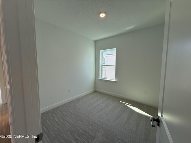 35 Mahogany Way, Palm Coast, FL 32164 - empty room with a textured ceiling and carpet