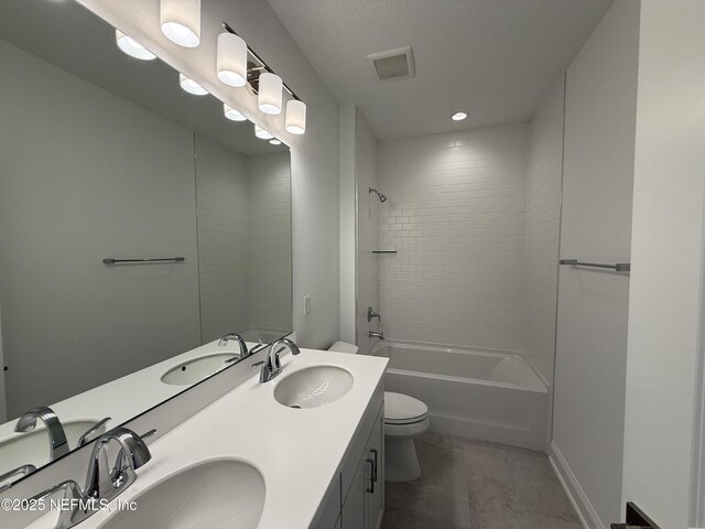 35 Mahogany Way, Palm Coast, FL 32164 - full bathroom featuring tiled shower / bath, vanity, and toilet