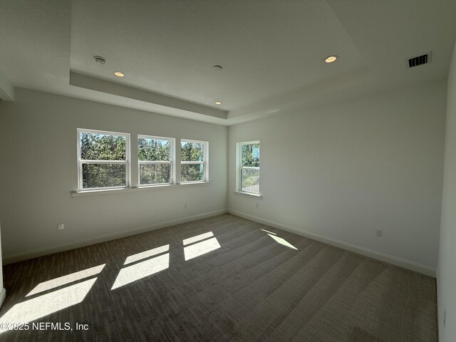 35 Mahogany Way, Palm Coast, FL 32164 - carpeted spare room featuring a tray ceiling