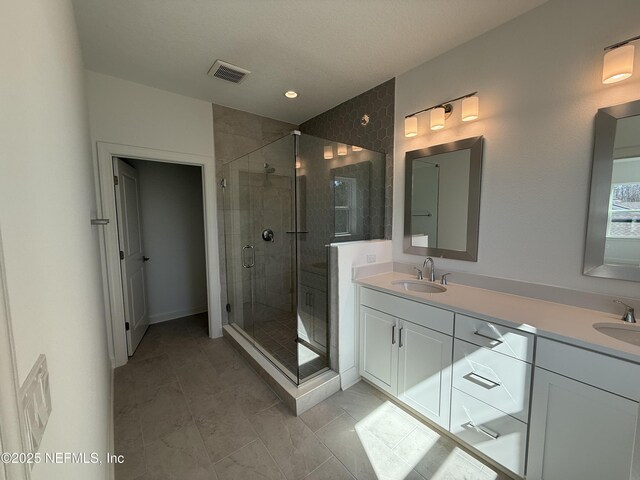 35 Mahogany Way, Palm Coast, FL 32164 - bathroom with vanity and a shower with shower door