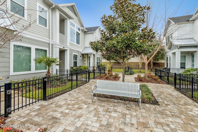 view of property's community with a fenced front yard