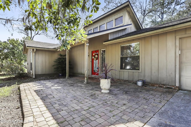 view of front of home featuring a patio area and board and batten siding