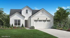 modern inspired farmhouse with a garage and a front lawn