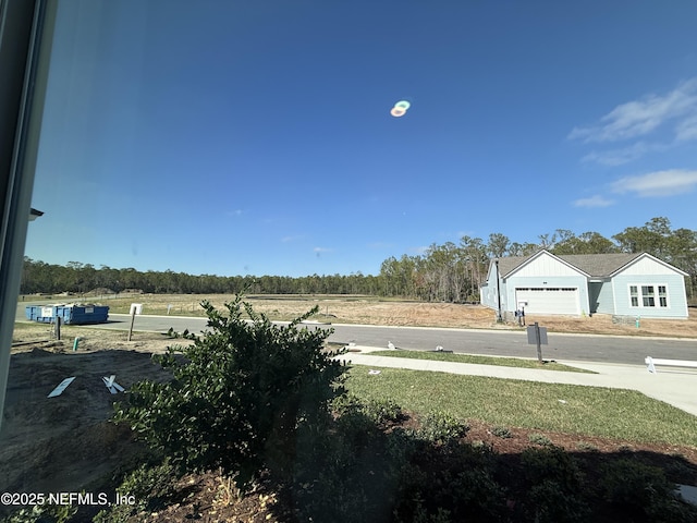 view of yard featuring a garage