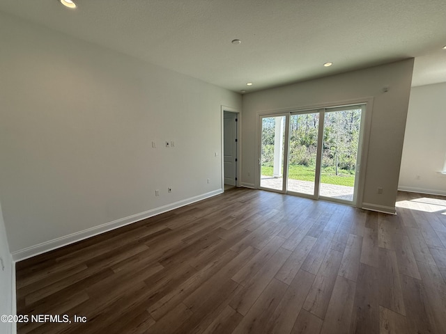 empty room featuring dark hardwood / wood-style floors