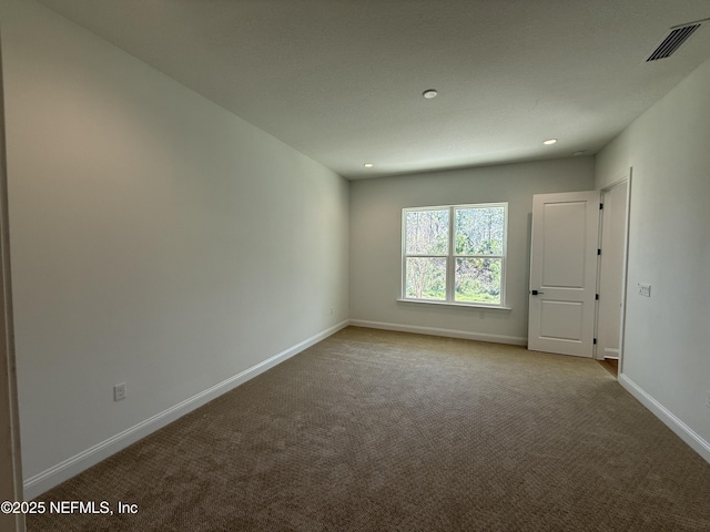 view of carpeted spare room