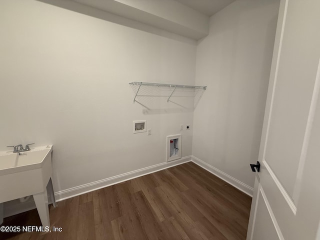 laundry area with sink, dark hardwood / wood-style flooring, hookup for a washing machine, and electric dryer hookup