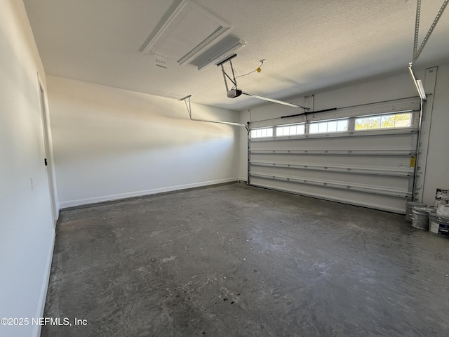 garage featuring a garage door opener