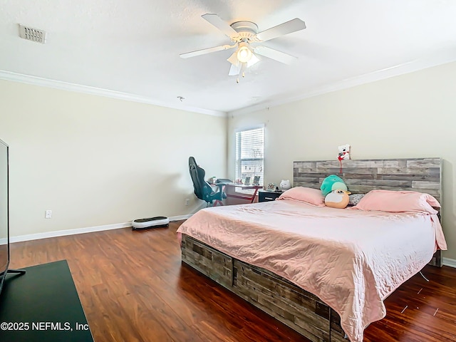 bedroom with wood finished floors, a ceiling fan, baseboards, visible vents, and crown molding