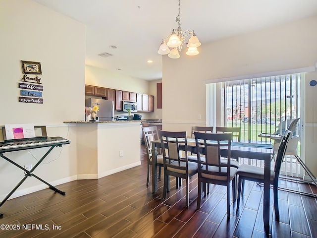 dining area featuring recessed lighting, a notable chandelier, wood finish floors, visible vents, and baseboards