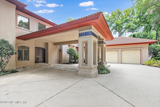 mediterranean / spanish-style house featuring a garage