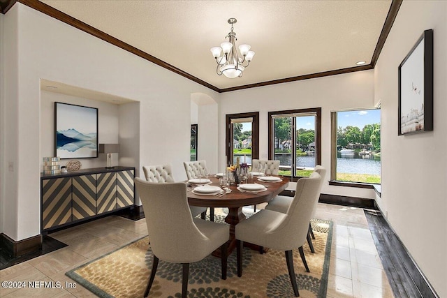 13612 Mcqueens Ct, Jacksonville, FL 32225 - dining space featuring a water view, ornamental molding, vaulted ceiling, and a notable chandelier