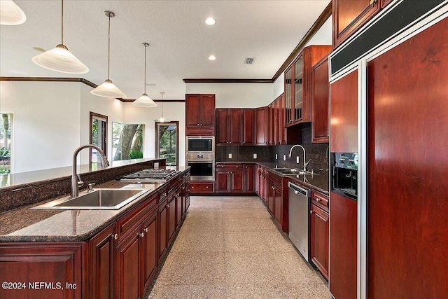 13612 Mcqueens Ct, Jacksonville, FL 32225 - kitchen featuring ornamental molding, pendant lighting, sink, and built in appliances