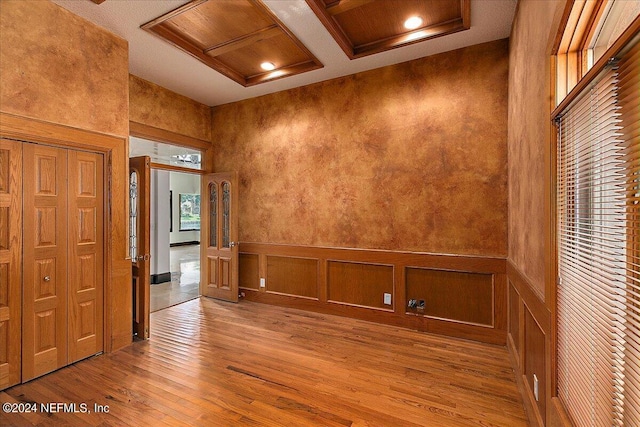 13612 Mcqueens Ct, Jacksonville, FL 32225 - empty room with coffered ceiling, hardwood / wood-style floors, and beam ceiling