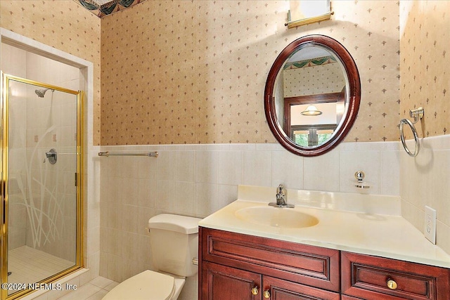 13612 Mcqueens Ct, Jacksonville, FL 32225 - bathroom featuring vanity, toilet, an enclosed shower, and tile walls
