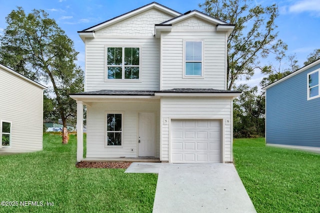 view of front of home featuring concrete driveway, a front lawn, and an attached garage