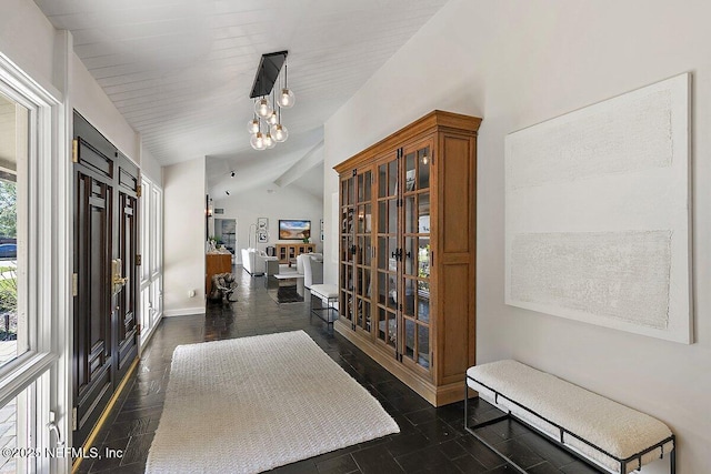 entrance foyer featuring vaulted ceiling with beams, french doors, and baseboards