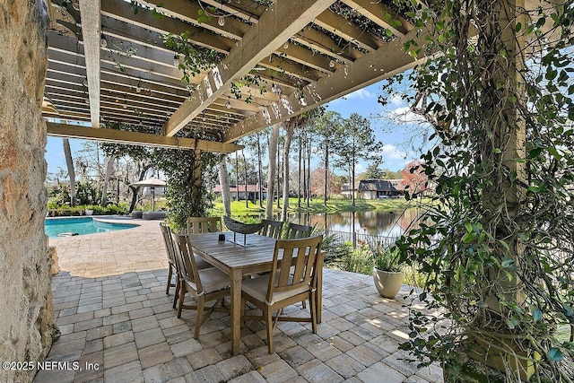 view of patio / terrace with a water view, a fenced in pool, a pergola, and outdoor dining space