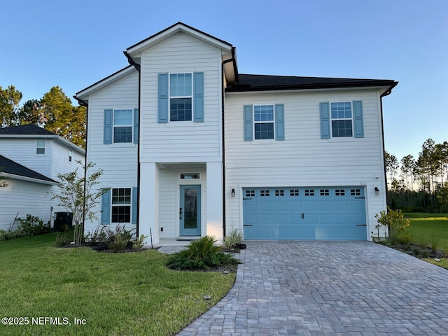 view of front of house featuring a garage and a front yard