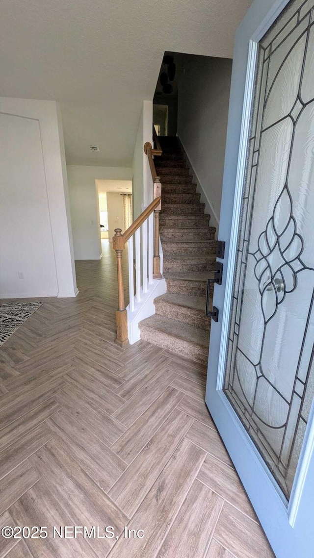 stairs with parquet floors