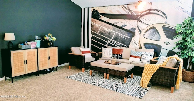 sitting room featuring light carpet