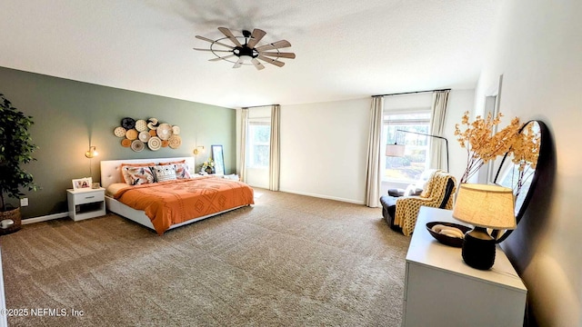 bedroom with carpet floors and a textured ceiling