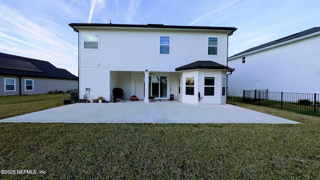 back of house featuring ceiling fan, a yard, a patio, and central air condition unit