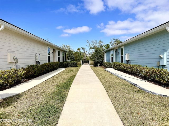 view of home's community with a yard