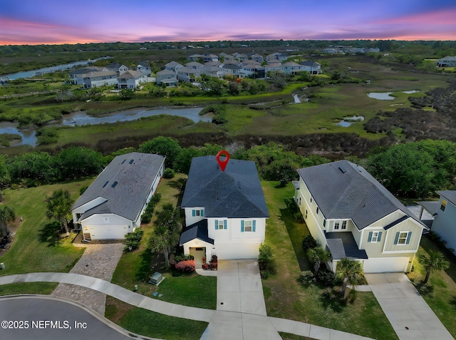 aerial view with a residential view and a water view