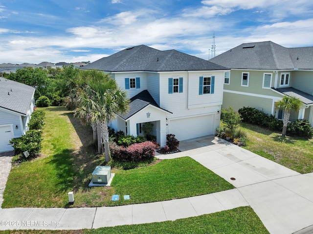 view of front of property with concrete driveway, a front yard, roof with shingles, and an attached garage