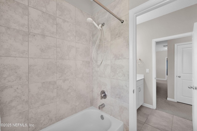 full bathroom featuring vanity, baseboards, and shower / washtub combination